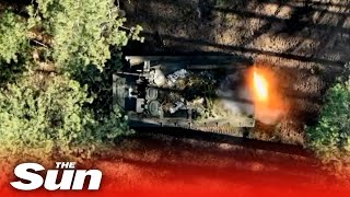 Ukrainian troops drop bombs on Russian tank