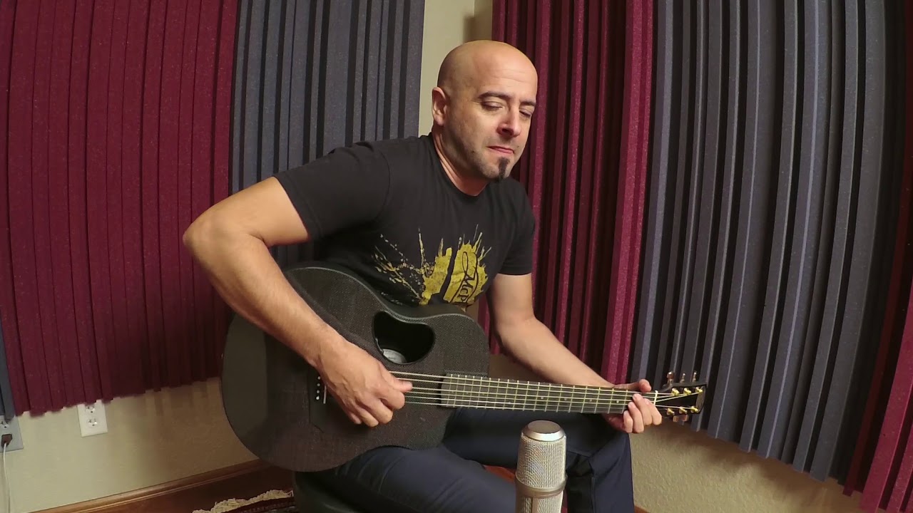 Juan John DeHoyos playing a McPherson Carbon Series Touring Guitar