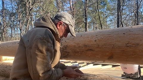 Highlights log cabin build part 5. Walls are going up! Scribing the logs, cutting the notches.