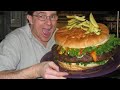 Giving a giant burger to a star customer