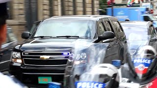 United States Embassy escort driving past the Elysee palace in Paris