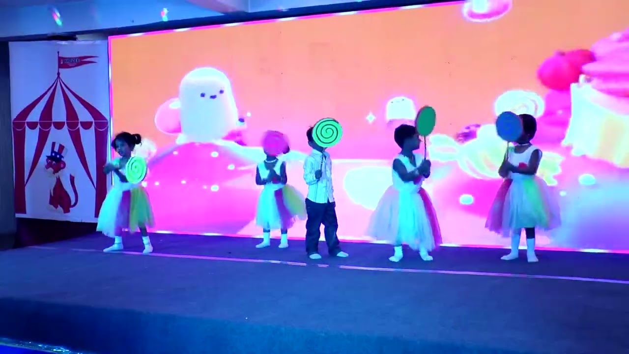 A catchy, cheerful carnival tune begins, Our pre kg children’s for their amazing performance .