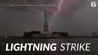 Massive lightning bolt strikes near Statue of Liberty in New York City
