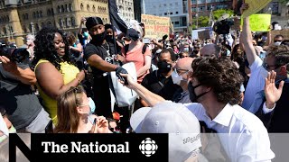 Thousands of people marched for racial justice in ontario on friday.
and while the prime minister toronto's police chief took a knee with
protesters ...