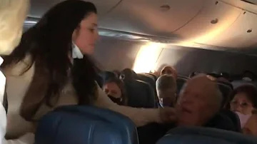 ‘Karen’ on Plane Appears to Punch and Spit on Passenger