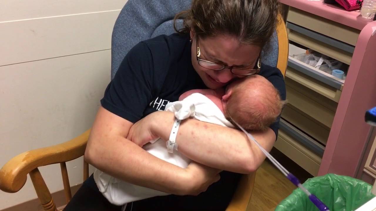 mom holds son for first time emotional youtube