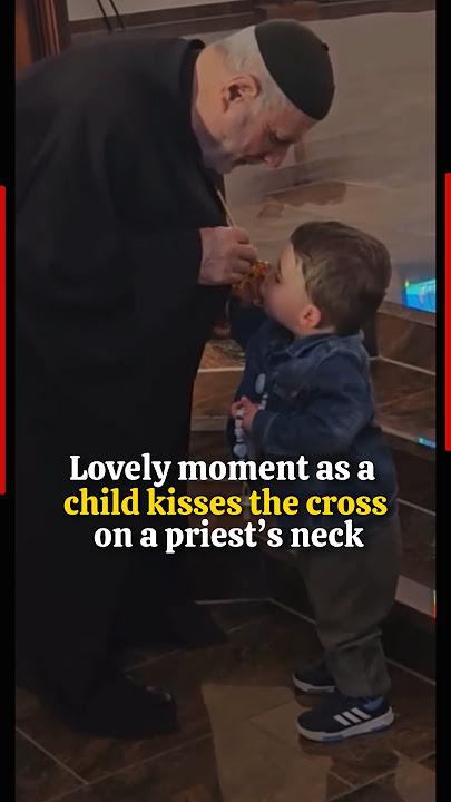 Lovely moment as a child kisses the cross on a priest’s neck #priest #mewpope #cross #rosary