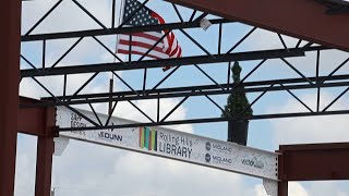Rolling Hills Library celebrates placing of final foundation beam on new building