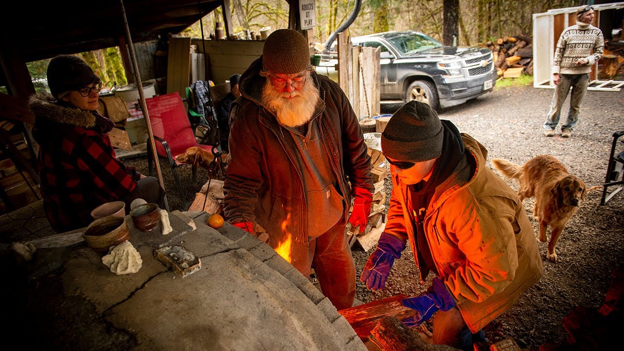 Ceramics class fires pots in the woods in an anagama kiln