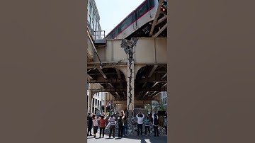 After a partial collapse of the metro bridge, a train derails, and the structure begins to fall