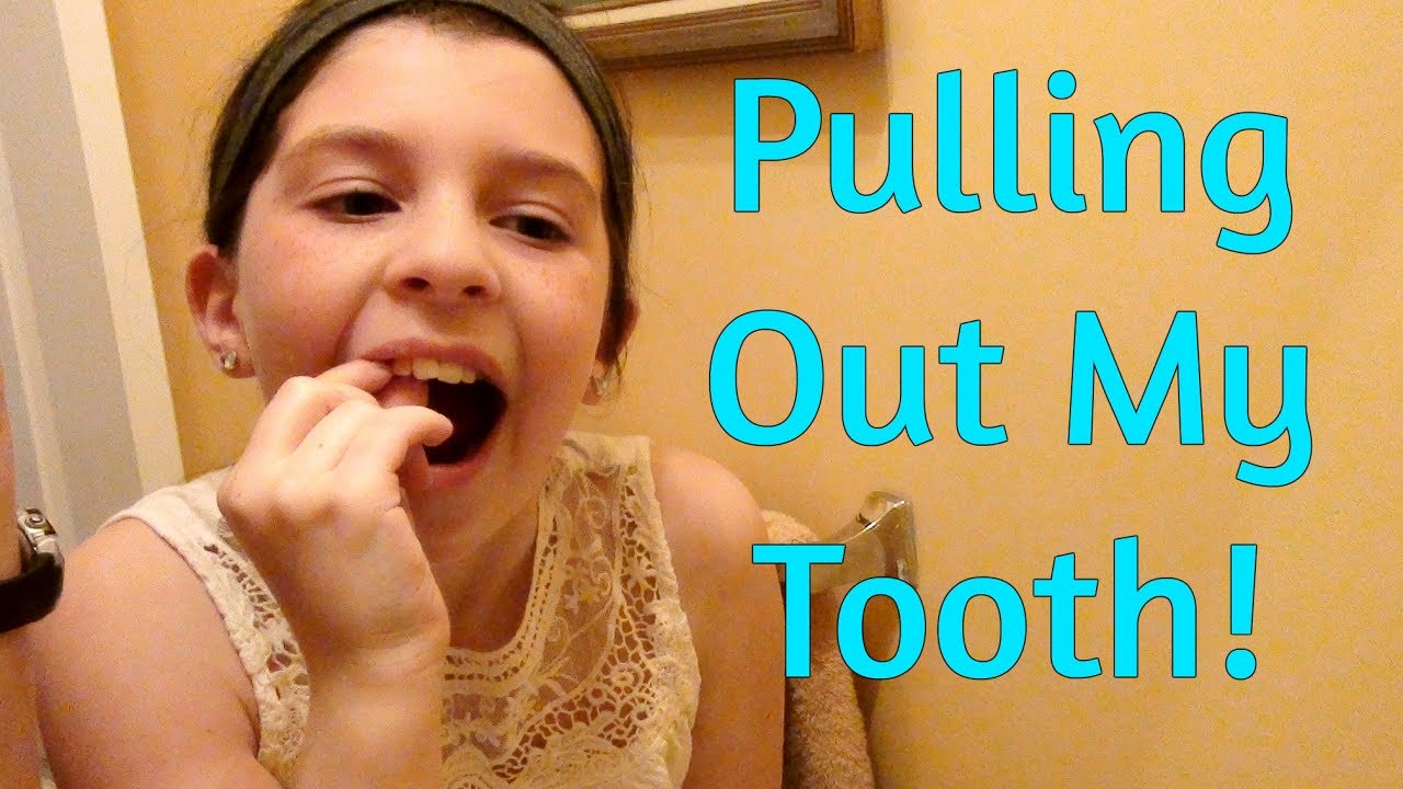 Pulling Out A Loose Tooth Youtube 