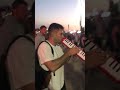 Guy plays "better off alone" on melodica at festival ORIGINAL