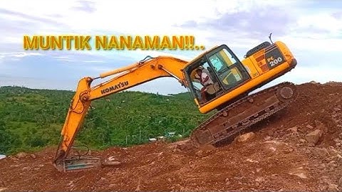 EXCAVATOR CLIMBING UPHILL AND MOVING DOWNHILL COMPILATION