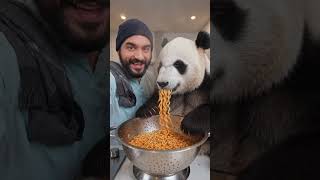 panda enjoying it's meal with me