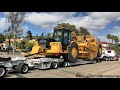 Hauling a brand new CAT 657 scraper from dealership to jobsite