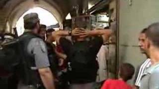 Israeli Soldiers attacking a Palestinian Mother and Son