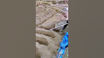 The process of digging the soil = good machinery can improve efficiency.