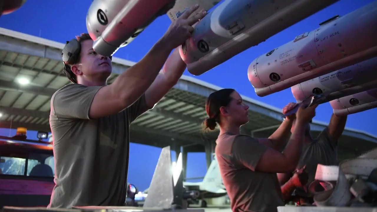 USAF Aircraft Armament Systems Specialists | Locked and Loaded weapons onto an F-15C eagle aircraft
