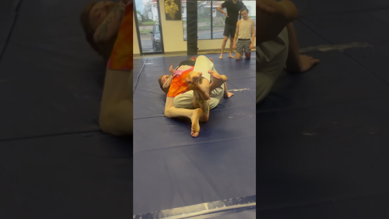 Professor Kevin Croom coaches on how to deal with the half guard lock down.