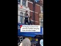 Terrifying moment man catches toddler hanging from window ledge