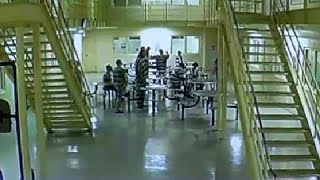 Jail surveillance video- Brandon Daniel bows, pumps fist following news coverage of shooting on Aug. Profile