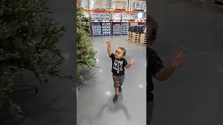 Baby Bubba running to show Daddy his favorite Costco holiday displays