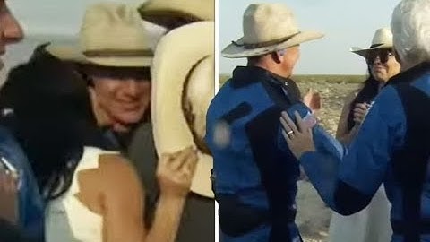 Jeff Bezos, 57, kissed by girlfriend Lauren Sanchez, 51, moments after landing from space