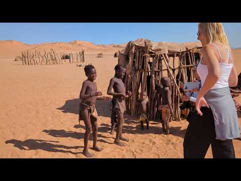 Maize porridge cooking, kids, huts at Himba Village, east of Serra Cafema, Namibia, 2023-05-25