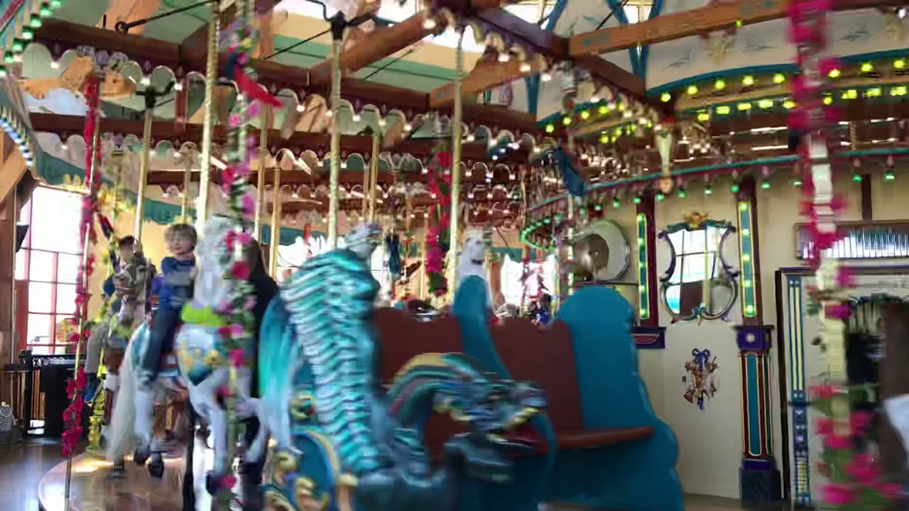 Baby riding carousel