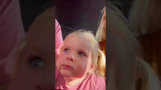 Girl Has an “Unsure” Reaction on Her Face during an Attraction Ride