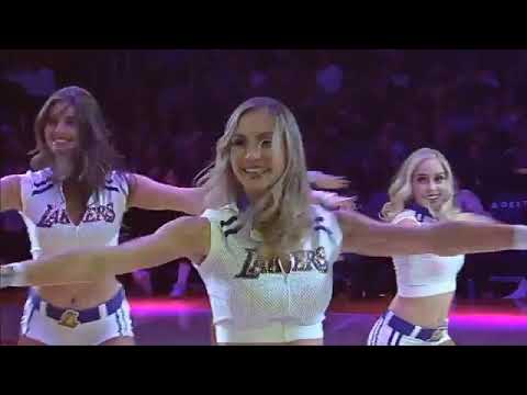 Lizzo dances along courtside as the Laker Girls dance to her song \