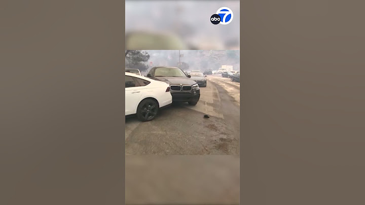 Hundreds of abandoned cars on Sunset Blvd pushed aside by fire dozer