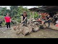 Mechanic girl repairs tractor with many broken parts