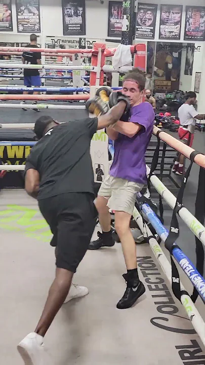 Jeff Mayweather working with a young fighter inside the Mayweather Boxing Club