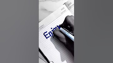 I write "Enjoyable" in blackletter calligraphy in using a blue marker. #lettering