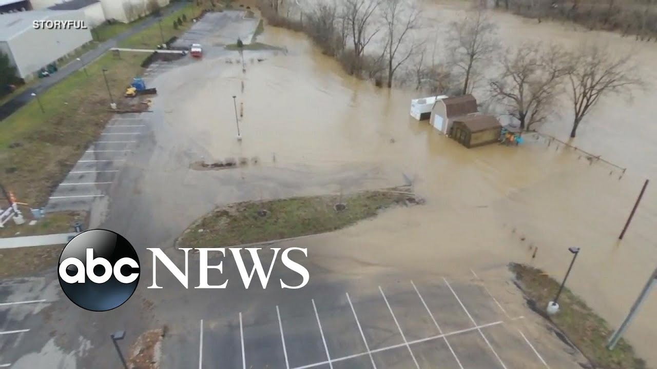 Rising flood waters take over roads, neighborhoods - YouTube