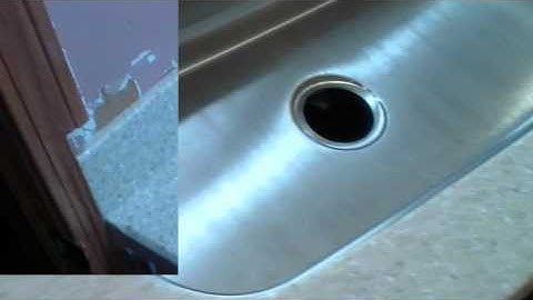 Livingstone solid surface countertop installed with a undermount stainless steel sink