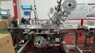 Industrial Top and Bottom Labeling System with C-Wrap | In-Plant Operation