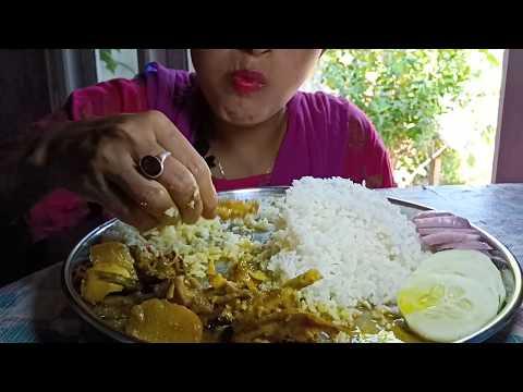 Eating delicious chicken curry with rice and salad