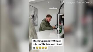 Zara McDermott hilariously tapes Sam Thompson's phone to his head