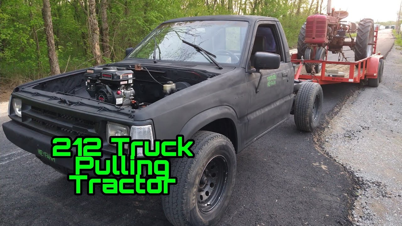 Predator 212 truck with 6.5 horsepower pulls the Farmall tractor. Harbor freight go kart truck