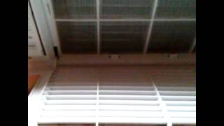 Loud air conditioner made quieter with weights