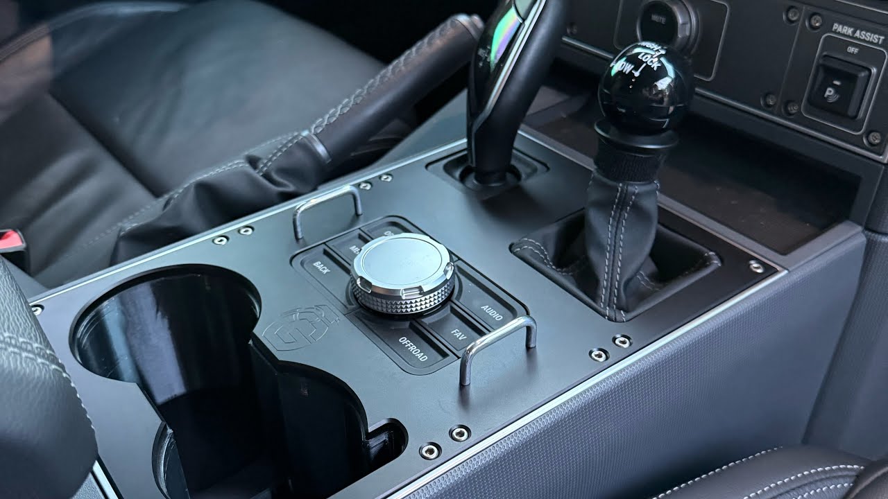 @grenadierusa machined aluminum center console panel and larger cup holders for Ineos Grenadier