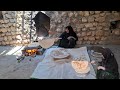 Nomadic life in Iran: Baking local bread by a nomadic woman in the heart of nature