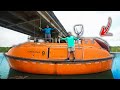 Camping In My 64 Person Enclosed LIFEBOAT Under A Bridge!!