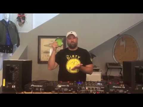 Claude VonStroke shaking a tiny tambourine