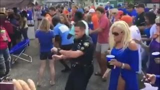 Watch This Police Officer Join Football Fans Dancing To Cupid Shuffle
