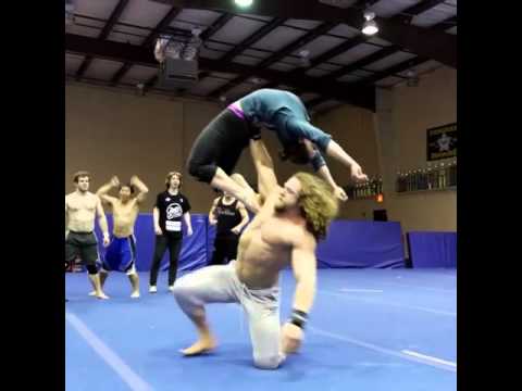 Muscular Man Throws Girl into Foam Pit