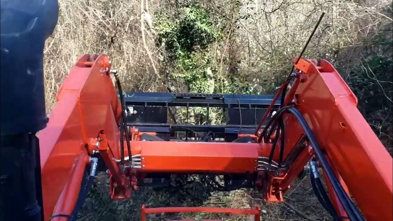 Clearing land with a tractor, grapple, and brush hog. YouTube