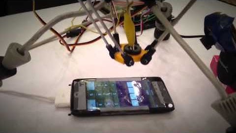 A Robot Brute-Forcing an iPhone